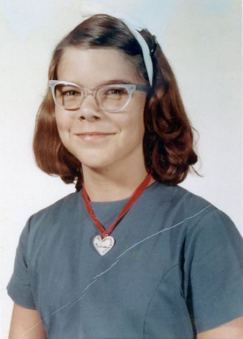 Melinda smiling with necklace in 1966